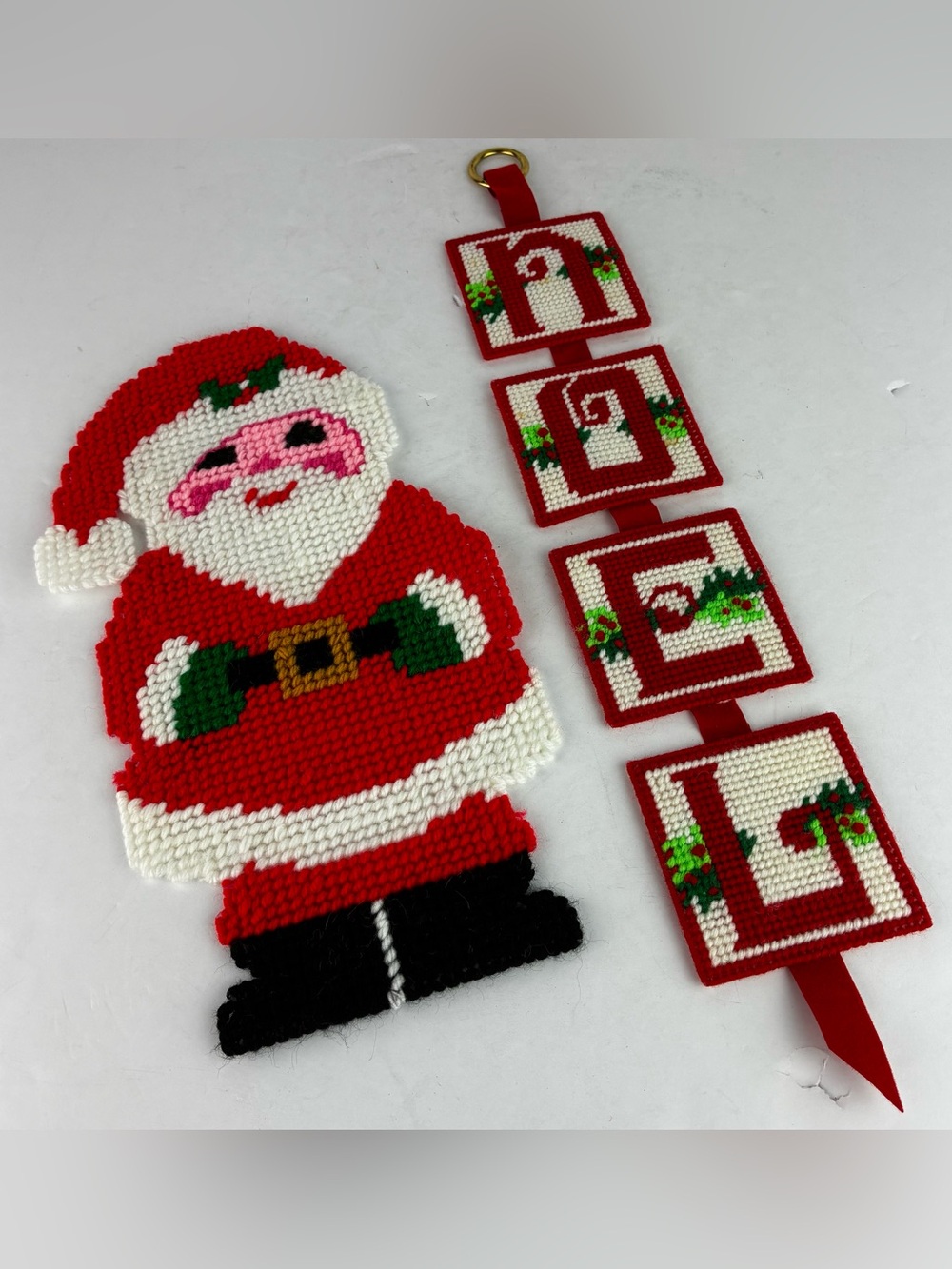Hand Crafted Vintage Plastic & Yarn Hooked Santa & Noel Wall Hangings Set of 2